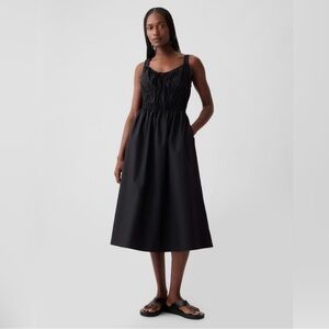 Gap smock waisted black cotton midi dress. NWT. Has never been opened. Size S.